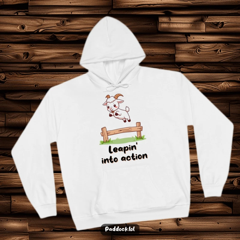 Funny hoodie showcasing a cartoon goat cheerfully leaping over a wooden fence, highlighting its energetic and fun-loving character.